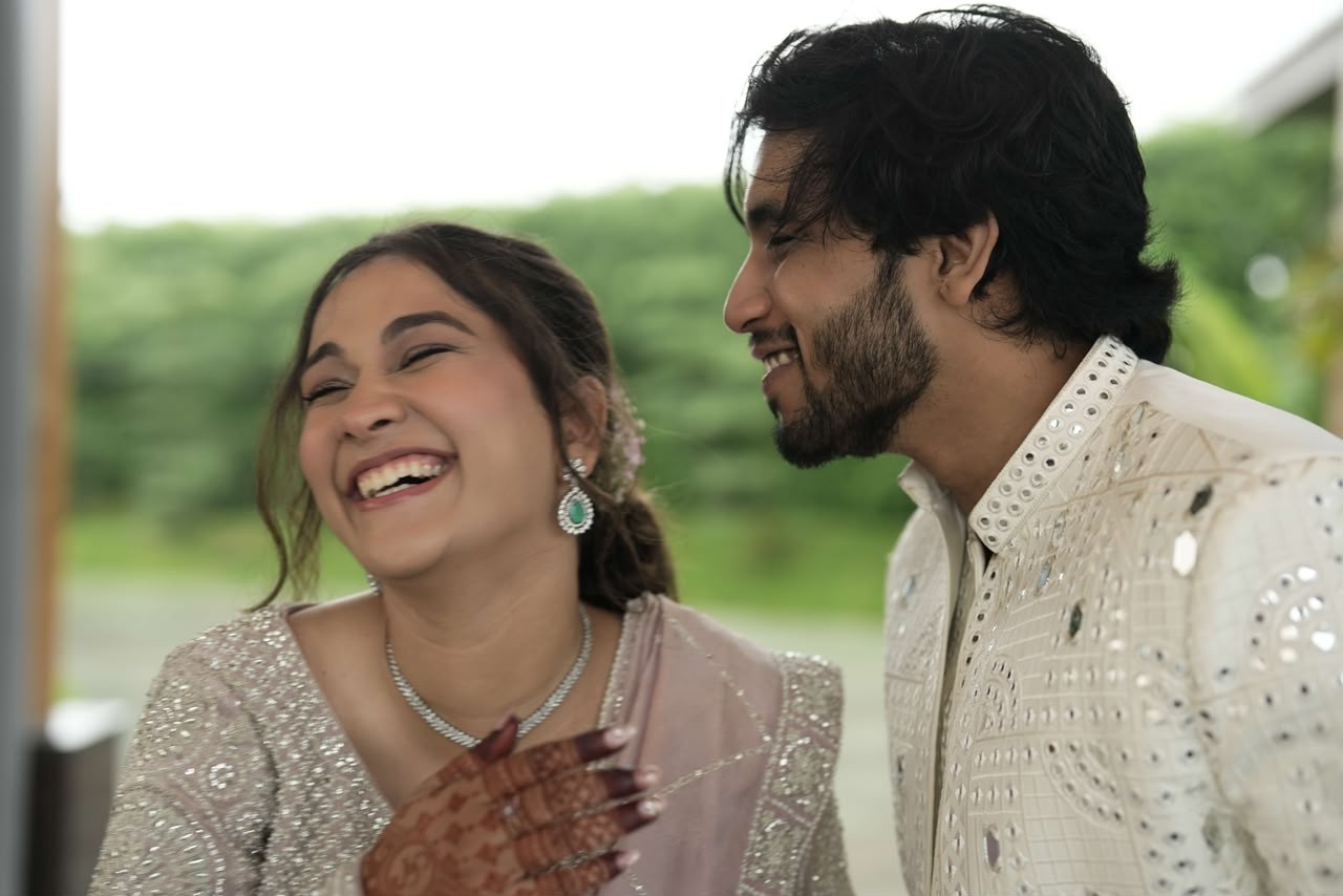 Shanya laughing as Sparsh smiles beside her